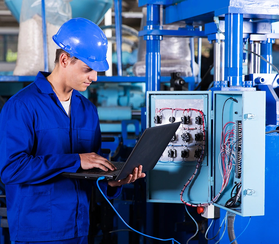 man-fixing-electric-line-of-machines