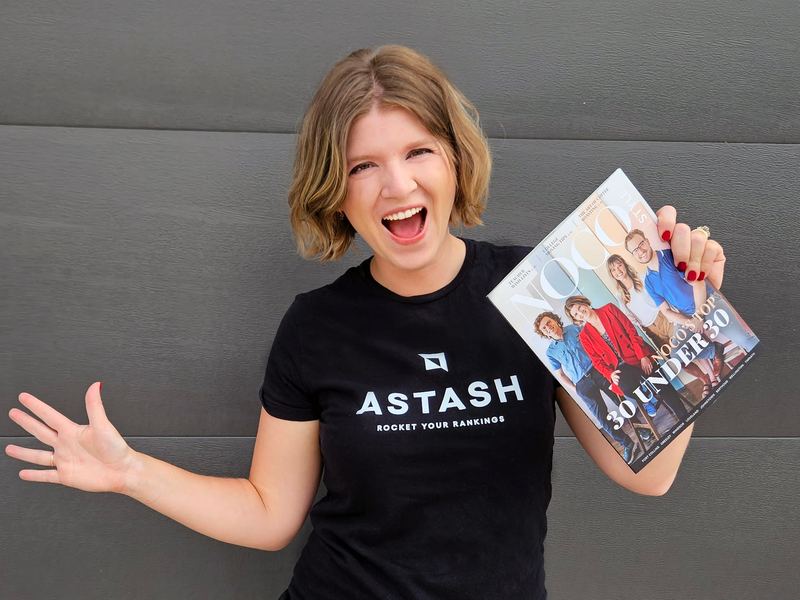 Kateryna Quinn in an aStash t-shirt holding the NOCO Style Top 30 Under 30 issue