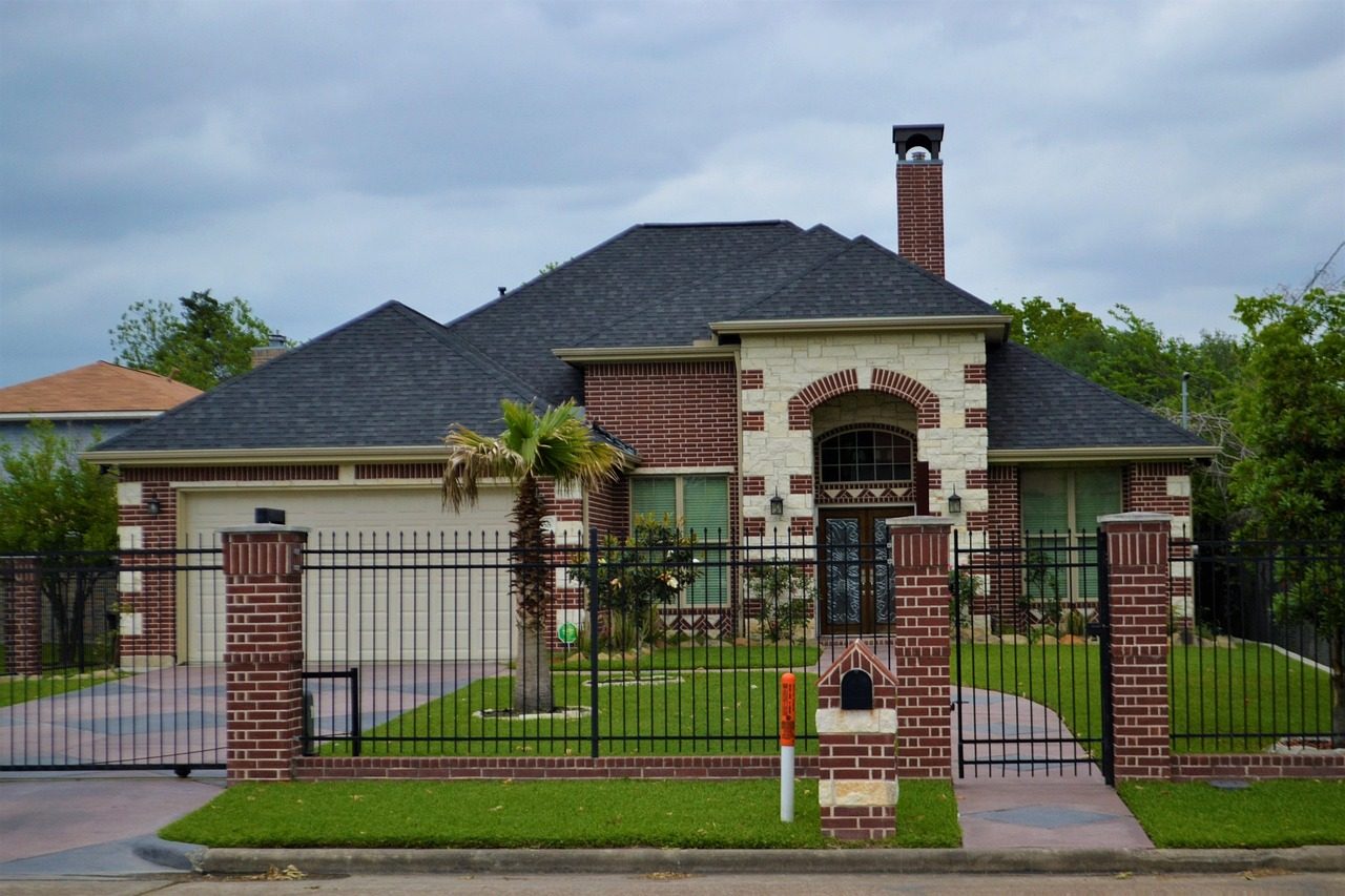 Brick home with palms in a south Houston neighborhood