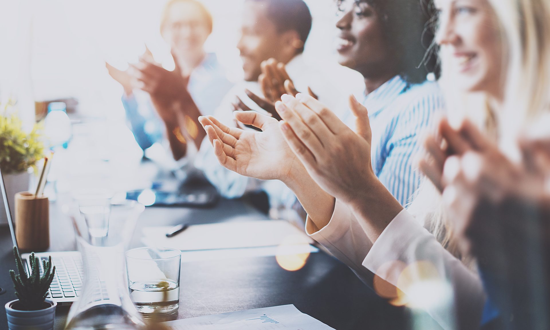 Team applauding in a meeting room