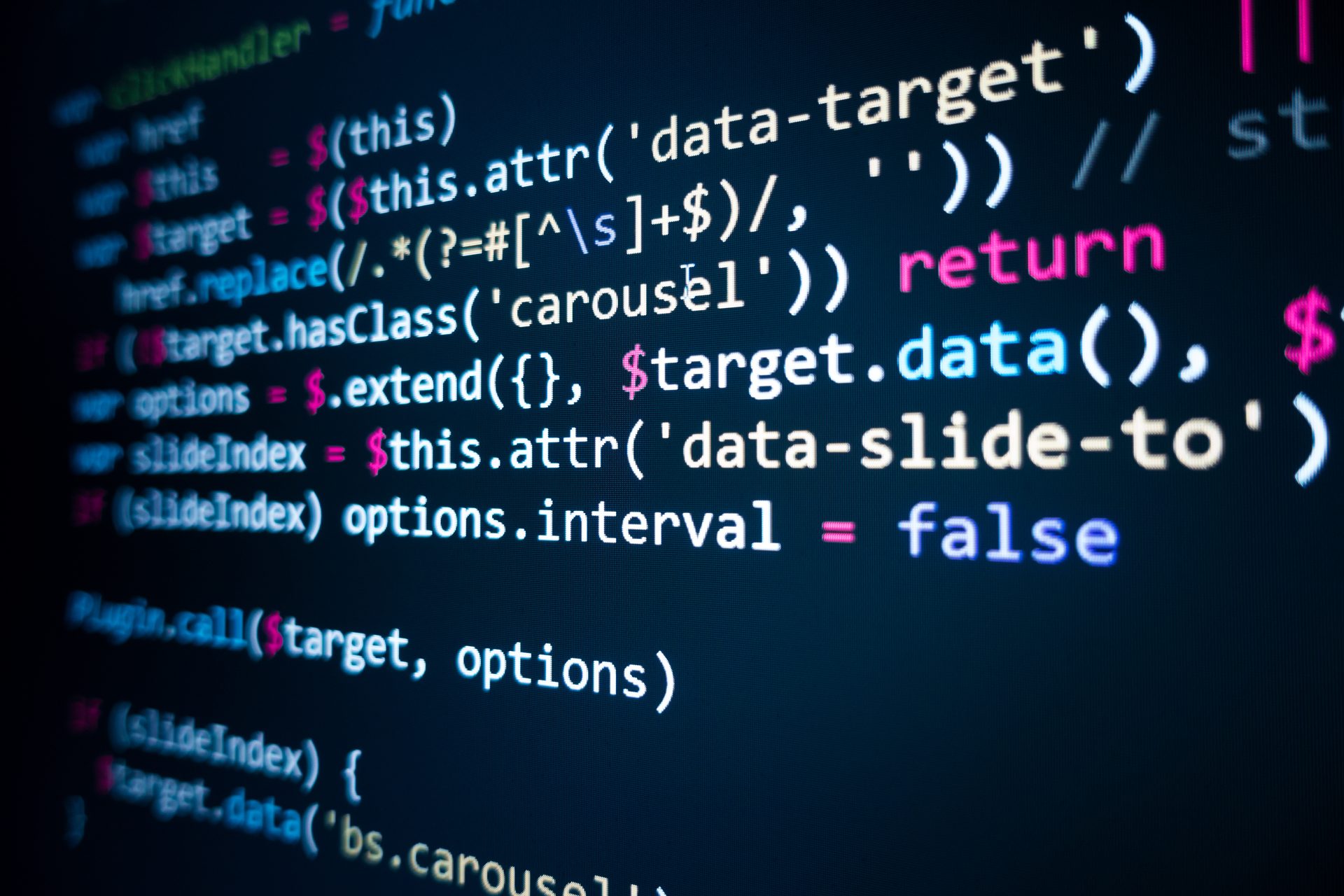 Lines of JavaScript code on a dark screen